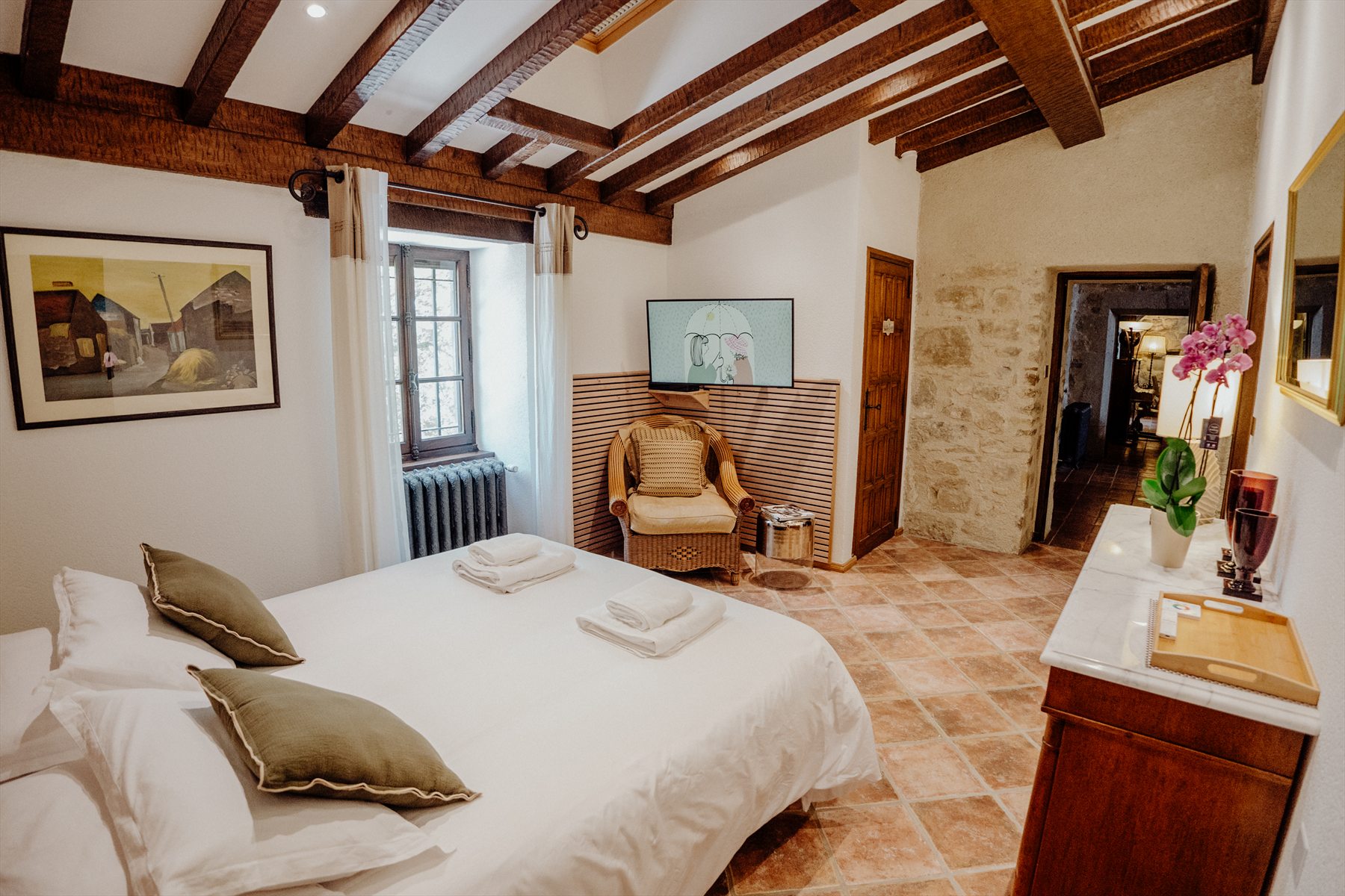 Honour Suite at Ch&acirc;teau de Tournou with stone walls and original beams