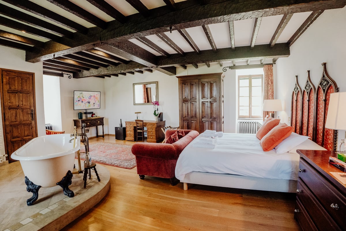 Historic château suite with a freestanding bath at Château de Tournou