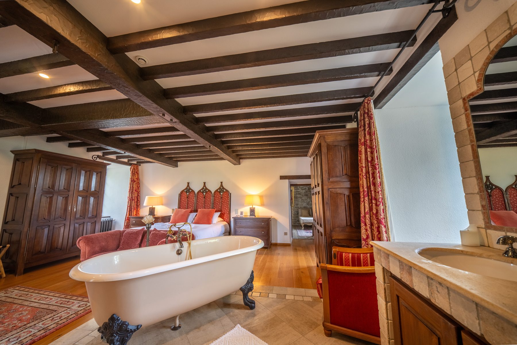 Bridal Suite at Ch&acirc;teau de Tournou with freestanding bathtub and exposed beams